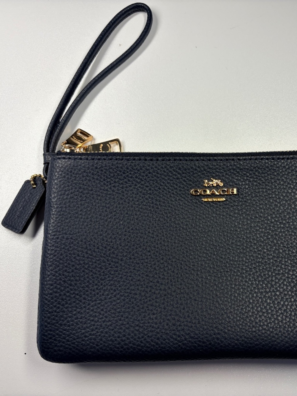 Authentic Coach Navy Pebble Leather Double Zip Wristlet w/ charm & Strap